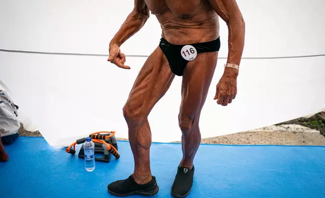 Japanese bodybuilder Toshisuke Kanazawa, 90, prepares to compete in the 2026 IFBB World Fitness and Bodybuilding Championships in Santa Susanna, Spain, Friday, Oct. 30, 2026. (AP Photo/Pau Venteo)
