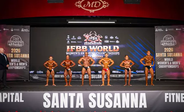 Japanese bodybuilder Toshisuke Kanazawa, 90, second from the right, competes in the 2026 IFBB World Fitness and Bodybuilding Championships in Santa Susanna, Spain, Friday, Oct. 30, 2026. (AP Photo/Pau Venteo)