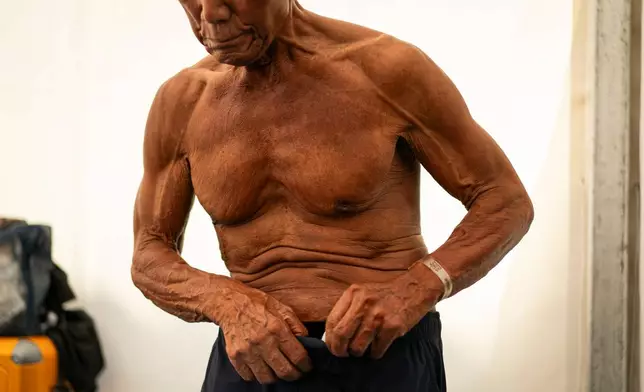 Japanese bodybuilder Toshisuke Kanazawa, 90, prepares to compete in the 2026 IFBB World Fitness and Bodybuilding Championships in Santa Susanna, Spain, Friday, Oct. 30, 2026. (AP Photo/Pau Venteo)