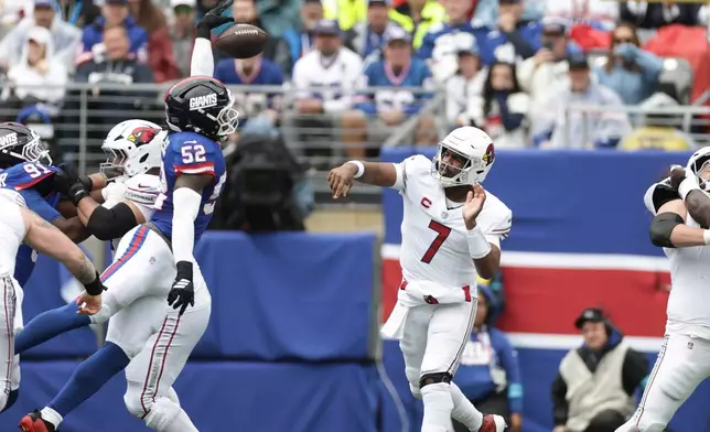 New York Giants linebacker Arvell Reese (52) gets a hand on a pass by Arizona Cardinals quarterback Jacoby Brissett (7) during an NFL football game, in East Rutherford, N.J., Sunday, Oct. 4, 2026. (AP Photo/Adam Hunger)