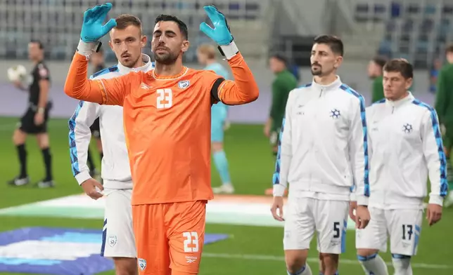 Israel's goalkeeper Assaf Tzur oerforms a ritual before the UEFA Nations League soccer match between the Republic of Ireland and Israel in Backa Topola, Serbia, Sunday, Oct. 4, 2026. (AP Photo/Darko Vojinovic)