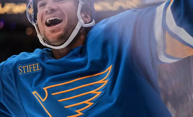 St. Louis Blues' Jimmy Snuggerud celebrates after scoring his second goal of the second period of an NHL hockey game against the Columbus Blue Jackets Saturday, Oct. 10, 2026, in St. Louis. (AP Photo/Jeff Roberson)