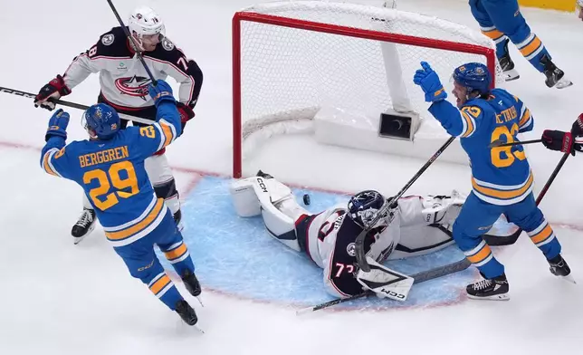 St. Louis Blues' Jonatan Berggren (29) celebrates after scoring past Columbus Blue Jackets goaltender Jet Greaves (73) during the third period of an NHL hockey game Saturday, Oct. 10, 2026, in St. Louis. (AP Photo/Jeff Roberson)