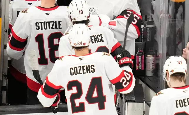 Ottawa Senators' Linus Ullmark (35) celebrates with teammates after they defeated the Boston Bruins in an NHL hockey game, Monday, Oct. 5, 2026, in Boston. (AP Photo/Charles Krupa)