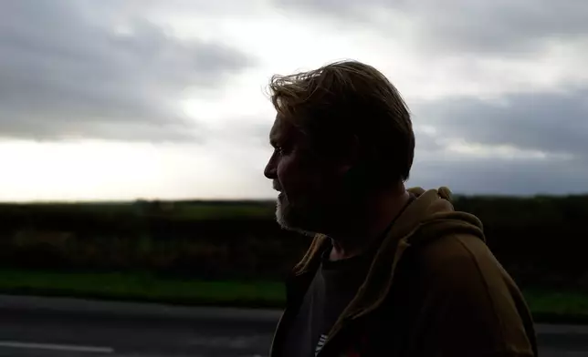 British adventurer Karl Bushby pauses near Market Rasen, Lincolnshire, England, Wednesday, Oct. 28, 2026, on the final stretch of his 28-year walk around the world to get back to his mother's home in Hull. (AP Photo/Brian Melley)