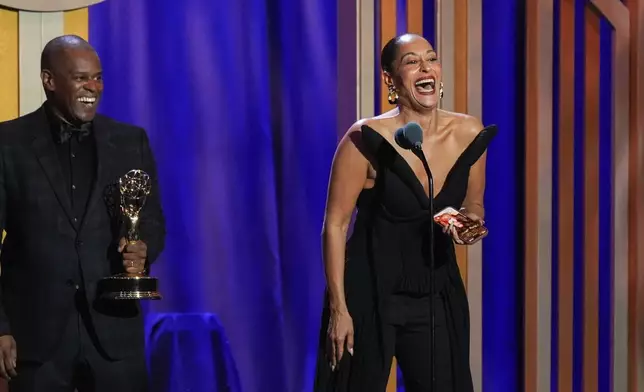 Tracee Ellis Ross, right, and the team from "Solo Traveling with Tracee Ellis Ross" accept the award for outstanding travel and adventure program during the 53rd Annual Daytime Emmy Awards on Friday, Oct. 30, 2026, at the Hollywood Palladium in Los Angeles. Tamara Tunie looks on from far left. (AP Photo/Chris Pizzello)