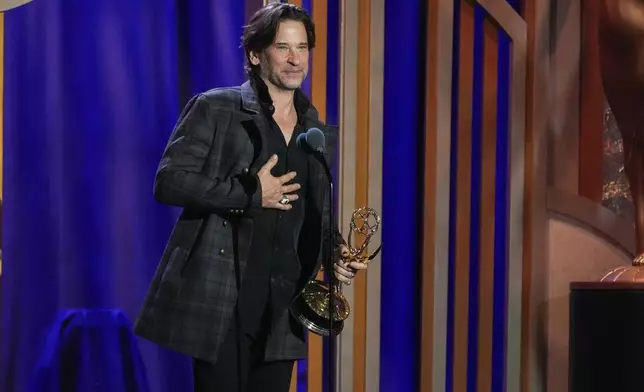 Roger Howarth accepts the award for outstanding supporting actor in a daytime drama series for "The Young and the Restless" during the 53rd Annual Daytime Emmy Awards on Friday, Oct. 30, 2026, at the Hollywood Palladium in Los Angeles. (AP Photo/Chris Pizzello)