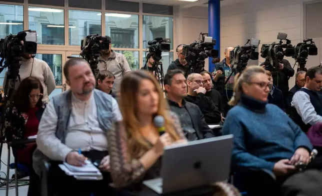 FILE - Members of the media work during the government's press conference on Thursday, Jan 18, 2024. In Hungary, Prime Minister Viktor Orbán has extended his party's control over the media, directly affecting informed democratic participation. (AP Photo/Denes Erdos, File)