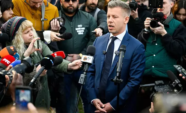 FILE - President of the opposition Tisza Party Peter Magyar talks to the media after casting his vote at a polling station during the general election in Budapest, Hungary, Sunday, April 12, 2026. (Robert Hegedus/MTI via AP, File)
