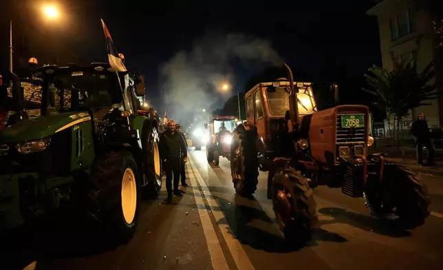 Supporters of Serbia's populist leader Aleksandar Vucic leave after a pre-election rally of the ruling Serbian Progressive Party (SNS) ahead of early parliamentary elections in Novi Sad, Serbia, Friday, Oct. 16, 2026. (AP Photo/Darko Vojinovic)