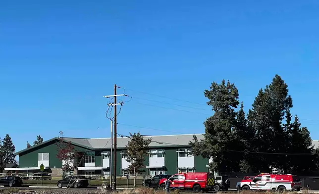 Police tape is placed outside Silver Rail Elementary school, where a shooting took place, on Thursday, Oct. 15, 2026 in Bend, Ore. (AP Photo/Joe Kline)