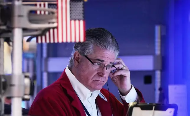 FILE - Trader Daniel Kryger works on the floor of the New York Stock Exchange, Monday, Feb. 2, 2026. (AP Photo/Richard Drew, File)