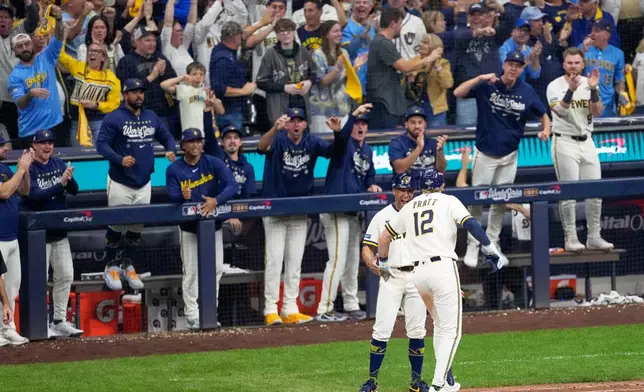 Milwaukee Brewers' Cooper Pratt celebrates a RBI-single during the seventh inning of Game 2 of baseball's World Series, Saturday, Oct. 24, 2026, in Milwaukee, between the Milwaukee Brewers and the Tampa Bay Rays. (AP Photo/David J. Phillip)