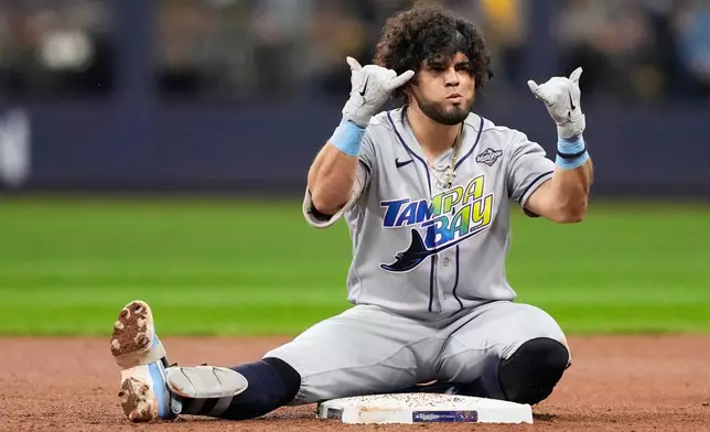 Tampa Bay Rays' Jonathan Aranda celebrates a double during the fifth inning of Game 2 of baseball's World Series, Saturday, Oct. 24, 2026, in Milwaukee, between the Milwaukee Brewers and the Tampa Bay Rays. (AP Photo/Kayla Wolf)