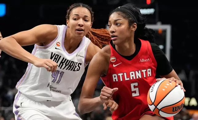 Atlanta Dream's Angel Reese (5) goes up to shoot against Golden State Valkyries' Kiah Stokes during the second half of Game 6 of the WNBA basketball finals on Thursday, Oct. 29, 2026, in Atlanta. (AP Photo/Brynn Anderson)