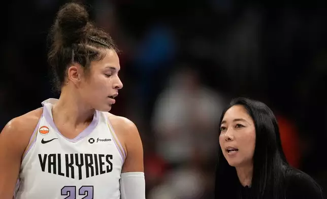 Golden State Valkyries head coach Natalie Nakase speaks with Veronica Burton during the first half of Game 6 of the WNBA basketball finals on Thursday, Oct. 29, 2026, in Atlanta. (AP Photo/Brynn Anderson)