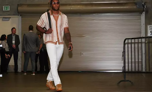 FILE - New Orleans Saints safety Justin Reid arrives before an NFL football game against the Seattle Seahawks, Sunday, Sept. 21, 2025, in Seattle. (AP Photo/Lindsey Wasson, File)