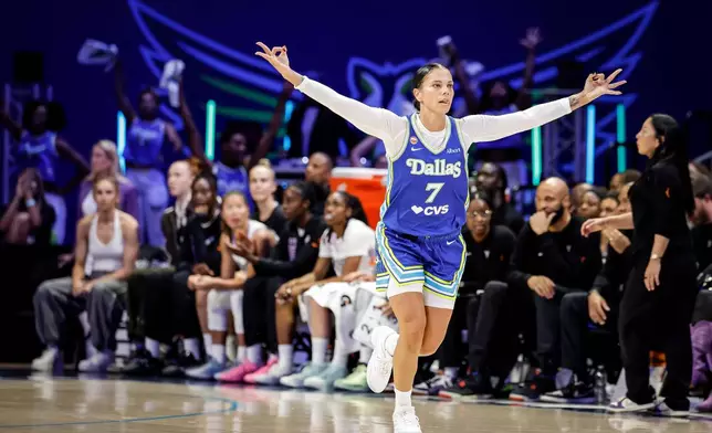 Alysha Clark (7) celebrates a 3-point basket in the first half as the Golden State Valkyries play the Dallas Wings in Game 2 of the WNBA playoffs first round in Arlington, Texas, on Wednesday, Sept. 30, 2026. (Carlos Avila Gonzalez/San Francisco Chronicle via AP)