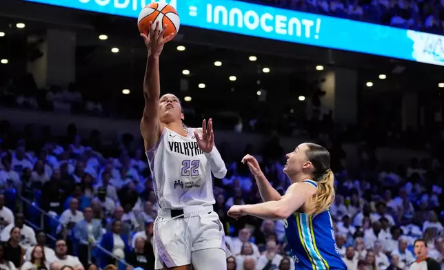 Golden State Valkyries guard Veronica Burton (22) shoots as Dallas Wings' Paige Bueckers, right, defends in the first half of a WNBA basketball first-round playoff game Wednesday Sept. 30, 2026, in Arlington, Texas. (AP Photo/Tony Gutierrez)
