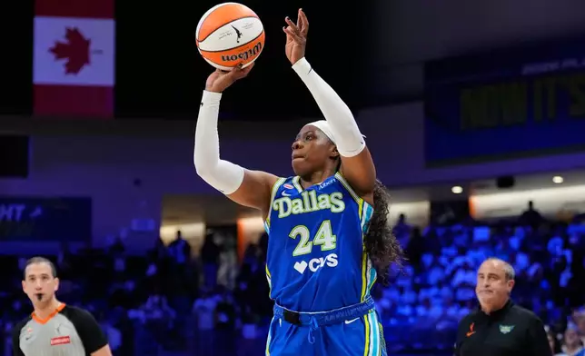 Dallas Wings' Arike Ogunbowale (24) shoots in the second half of a WNBA basketball first-round playoff game against the Golden State Valkyries Wednesday Sept. 30, 2026, in Arlington, Texas. (AP Photo/Tony Gutierrez)