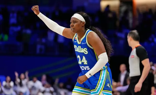 Dallas Wings' Arike Ogunbowale celebrates a basket in the second half of a WNBA basketball first-round playoff game against the Golden State Valkyries Wednesday Sept. 30, 2026, in Arlington, Texas. (AP Photo/Tony Gutierrez)