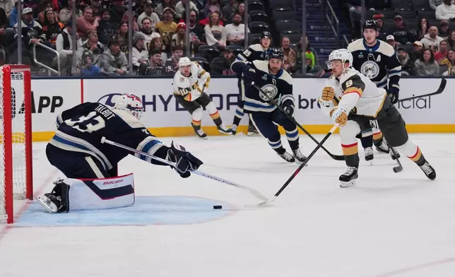 Vegas Golden Knights center Jack Eichel (9) attempts a shot as Columbus Blue Jackets goaltender Cam Talbot (33) defends during the first period of an NHL hockey game Saturday, Oct. 24, 2026, in Columbus, Ohio. (AP Photo/Joshua A. Bickel)