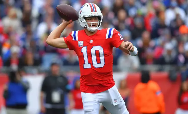 New England Patriots quarterback Drake Maye (10) looks to pass against the Las Vegas Raiders during an NFL football game in Foxborough, Mass., Sunday, Oct. 11, 2026. (AP Photo/Steven Senne)