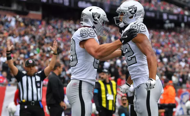 Las Vegas Raiders tight end Brock Bowers (89) celebrates his touchdown against the New England Patriots with teammate Cody White (82) during an NFL football game in Foxborough, Mass., Sunday, Oct. 11, 2026. (AP Photo/Steven Senne)