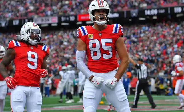 New England Patriots tight end Hunter Henry (85) celebrates after his touchdown against the Las Vegas Raiders during an NFL football game in Foxborough, Mass., Sunday, Oct. 11, 2026. (AP Photo/Steven Senne)