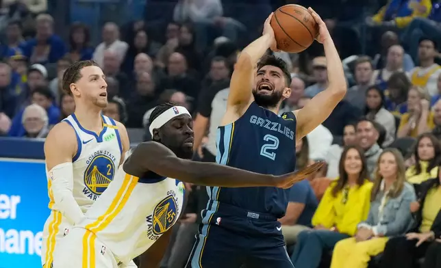 Memphis Grizzlies guard/forward Ty Jerome (2) is fouled by Golden State Warriors forward/center Graham Ike (45) during the first half of an NBA basketball game, Friday, Oct. 23, 2026, in San Francisco. (AP Photo/Jeff Chiu)