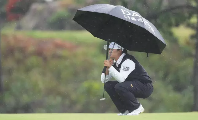 South Korea's Haeran Ryu lines up a putt on the 18th green during the third round of the LPGA BMW Ladies Championship at the Pine Beach Golf Links, in Haenam, South Korea, Saturday, Oct. 24, 2026. (AP Photo/Lee Jin-man)