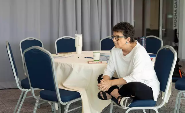 Cindy Weiser listens intently during a training from Arizona Faith Network for poll chaplains and peacekeepers, Tuesday, Oct. 6, 2026, ahead of the upcoming general midterm election, at Temple Chai in Scottsdale, Ariz. (AP Photo/Rebecca Noble)