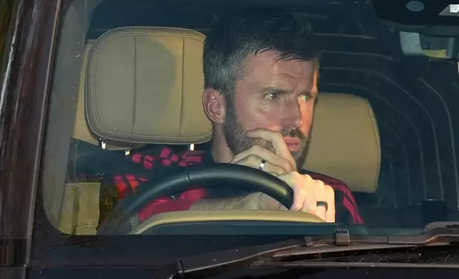 Manchester United soccer team manager Michael Carrick arrives at the team's training center in Manchester, England, Tuesday Oct. 27, 2026. (Annabel Lee-Ellis/PA via AP)