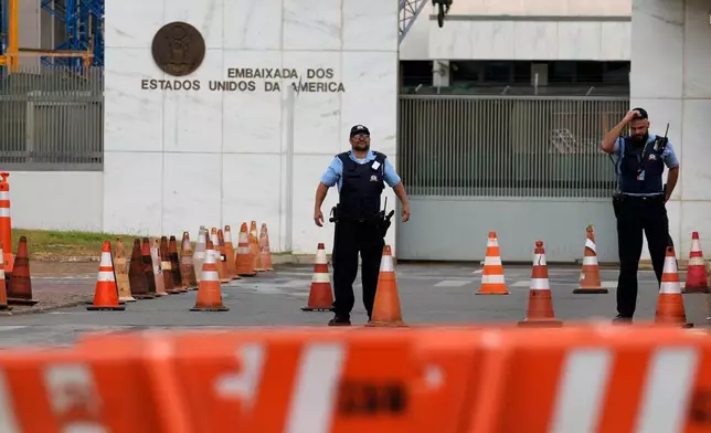 Security personnel stand outside the U.S. Embassy after consular services were suspended due to security concerns in Brasilia, Brazil, Friday, Oct. 2, 2026. (AP Photo/Eraldo Peres)
