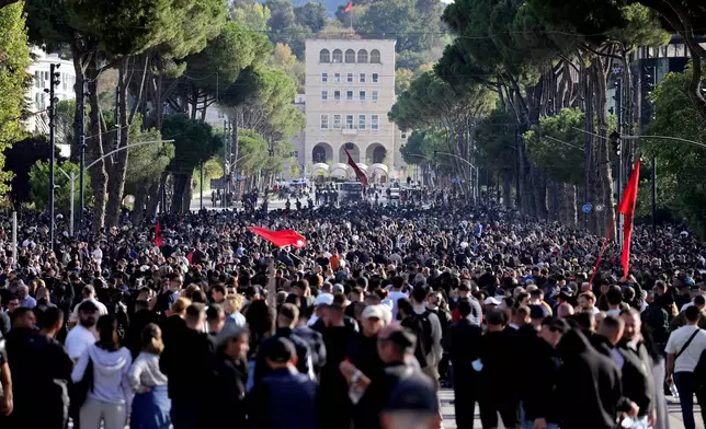 Protesters gather during an anti-government rally, in Tirana, Albania, Saturday, Oct. 24, 2026. (AP Photo/Hameraldi Agolli)