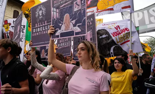 Members of right-wing student groups march through the streets of Rome during a demonstration called "Unlock Everything," organized in opposition to recent left-wing student protests and one of several demonstrations held by groups across the political spectrum, Saturday, Oct. 24, 2026. (AP Photo/Gregorio Borgia)