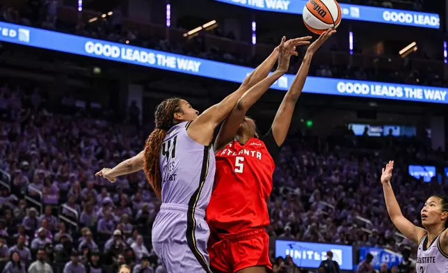 Atlanta Dream forward Angel Reese (5) is fouled by Golden State Valkyries center Kiah Stokes (41) during the second half of Game 2 of the WNBA basketball finals, Monday, Oct. 19, 2026, in San Francisco. (AP Photo/Justine Willard)