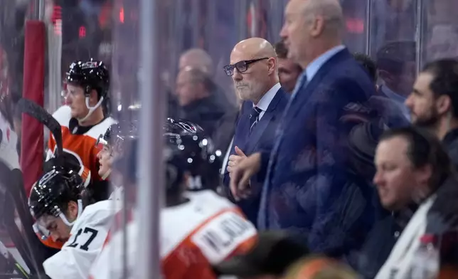 Philadelphia Flyers' Rick Tocchet watches during the third period of an NHL hockey game against the Carolina Hurricanes Sunday, Oct. 11, 2026, in Philadelphia. (AP Photo/Matt Slocum)