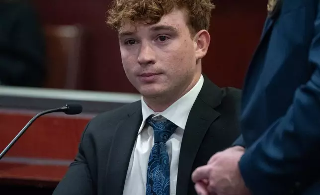 Carter Eslick is fingerprinted during his sentencing hearing in Coconino County Superior Court in Flagstaff, Ariz., on Wednesday, Sept. 30, 2026. (Mark Henle/The Arizona Republic via AP, Pool)