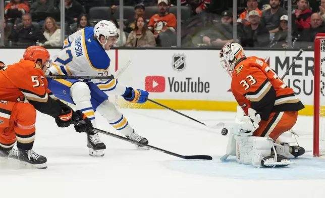 Buffalo Sabres center Tage Thompson, center, scores a goal past Anaheim Ducks goaltender Ville Husso (33) during the first period of an NHL hockey game Thursday, Oct. 29, 2026, in Anaheim, Calif. (AP Photo/Gregory Bull)