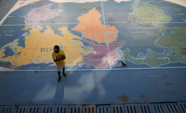 A voter stands at a polling station during a presidential runoff in Brasilia, Brazil, Sunday, Oct. 25, 2026. (AP Photo/Eraldo Peres)