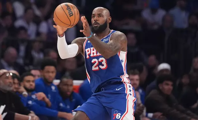Philadelphia 76ers forward LeBron James grabs a pass during the first half of an NBA basketball game against the New York Knicks Tuesday, Oct. 20, 2026, in New York. (AP Photo/Frank Franklin II)