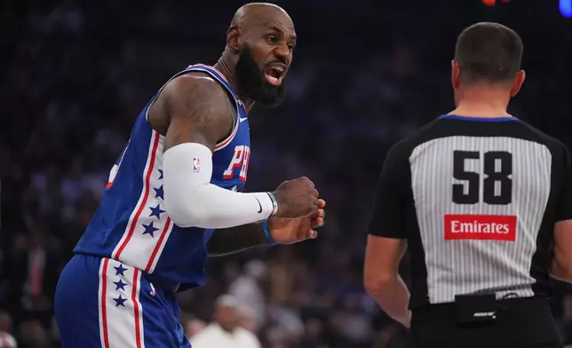 Philadelphia 76ers forward LeBron James discusses a call with a referee during the first half of an NBA basketball game against the New York Knicks Tuesday, Oct. 20, 2026, in New York. (AP Photo/Frank Franklin II)