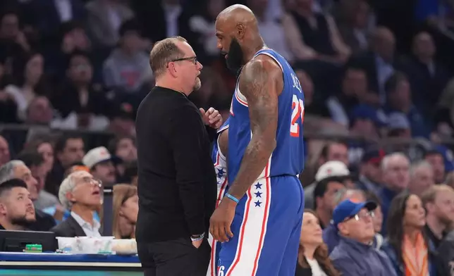 Philadelphia 76ers forward LeBron James speaks with head coach Nick Nurse during the first half of an NBA basketball game against the New York Knicks Tuesday, Oct. 20, 2026, in New York. (AP Photo/Frank Franklin II)