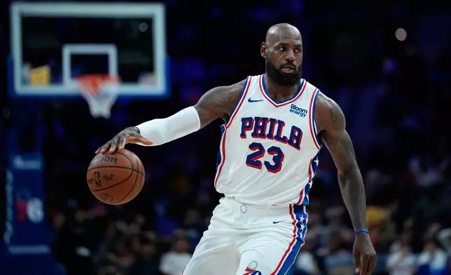 Philadelphia 76ers' LeBron James dribbles during the second half of a preseason NBA basketball game against the Boston Celtics Friday, Oct. 16, 2026, in Philadelphia. (AP Photo/Matt Slocum)