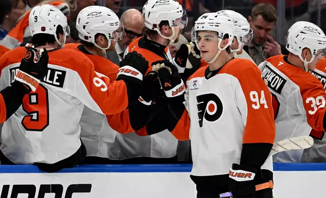 Philadelphia Flyers right wing Porter Martone (94) celebrates after his goal during the second period of an NHL hockey game against the Tampa Bay Lightning, Monday, Oct. 5, 2026, in Tampa, Fla. (AP Photo/Jason Behnken)