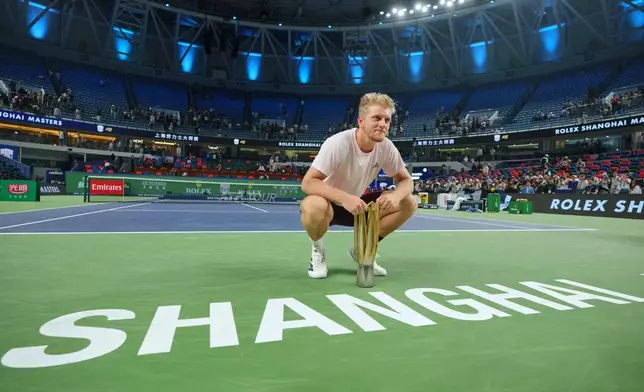Spain's Alejandro Davidovich Fokina poses with the championship trophy after winning the men's singles final against Spain's Rafael Jodar at the Shanghai Masters tennis tournament in Shanghai, China, Sunday, Oct. 18, 2026. (AP Photo/Andy Wong)