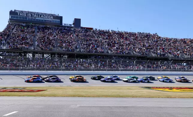 Chase Briscoe (19) leads the pack to the start of a NASCAR Cup Series auto race, Sunday, Oct. 25, 2026, in Talladega, Ala. (AP Photo/Butch Dill)