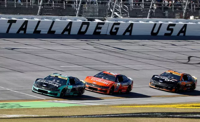Ryan Preece (60), Brad Keselowski (6), and Chris Buescher (17) break away from the pack in the first stage of a NASCAR Cup Series auto race, Sunday, Oct. 25, 2026, in Talladega, Ala. (AP Photo/Butch Dill)