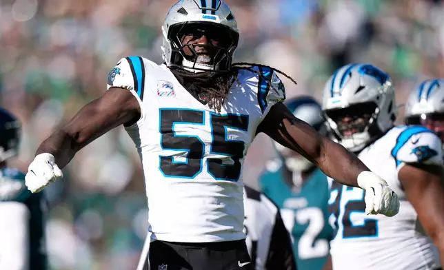 Carolina Panthers linebacker Devin Lloyd celebrates his sack of Philadelphia Eagles quarterback Tanner McKee during the second half of an NFL football game in Philadelphia, Sunday, Oct. 18, 2026. (AP Photo/Chris Szagola)